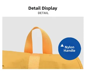 Close-up detail showing the durable yellow nylon handle and fabric of the backpack