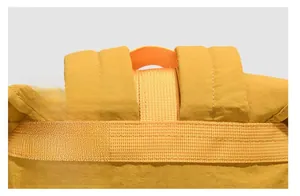 Detailed close-up showing neat and reinforced stitching on yellow backpack straps