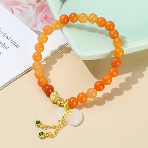 Natural red aventurine beaded bracelet with white jade lucky bag and gold clover charm