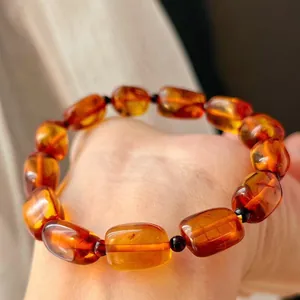 Close-up of retro Maillard style amber beaded bracelet showing honey wax texture.