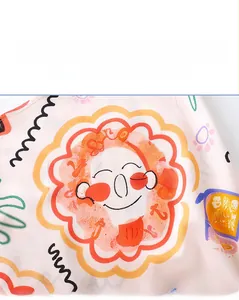 Close-up detail of colorful cartoon doodle print on girl's summer sleeveless dress