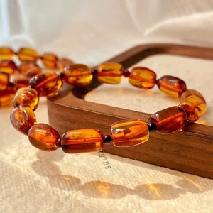 Detailed close-up showing the rich texture of a vintage natural amber honey wax bracelet