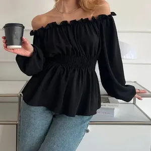 Elegant black off-the-shoulder blouse featuring a smocked waist and stylish ruffle hem