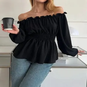 Elegant black off-the-shoulder blouse with smocked waist and ruffled puff sleeves