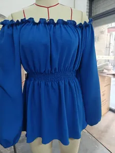 Royal blue off-the-shoulder long sleeve blouse with ruffled waist and puff sleeves.