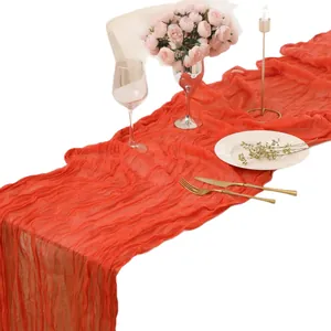 Elegant orange wrinkled cheesecloth table runner for rustic wedding and party decor