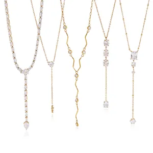 Elegant collection of five gold titanium steel Y-shaped necklaces with cubic zirconia stones.