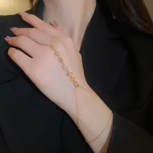 Detailed view of elegant 14k gold-plated zircon flower slave bracelet on hand