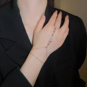 Elegant 14k gold plated slave bracelet with sparkling zircons and flower charms for women.