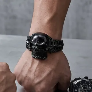 Detailed macro view of a gothic black stainless steel skull bracelet with bone textures