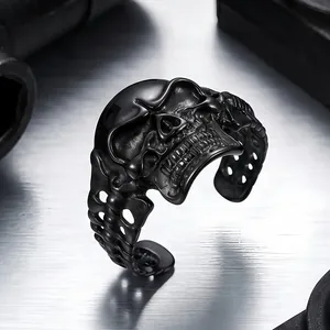 Close-up of a vintage punk style black stainless steel skull bone cuff bracelet detail