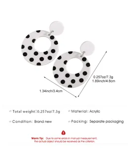 Detailed view of black and white polka dot acrylic hoop earrings with dimensions.