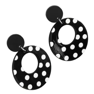 Detailed view of the retro black and white polka dot acrylic hollow round earrings