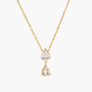 Élégant collier en acier inoxydable doré avec deux pendentifs en zircone goutte