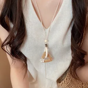 Summer bohemian woven rattan triangle pendant necklace with flower detail for women