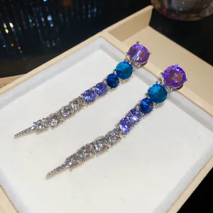 Elegant long drop earrings with purple-to-clear gradient round crystals and silver needles.