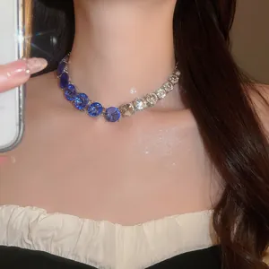 Close-up of sparkling round gradient blue and white crystal necklace for elegant evening wear