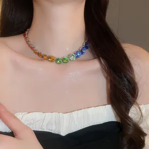 Detailed view of an elegant rainbow gradient round crystal necklace worn by a model