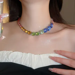 Detail view of a rainbow gradient rhinestone tennis necklace on an Asian model's neck