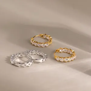 Classic stainless steel hoop earrings set with round white cubic zirconia in gold and silver