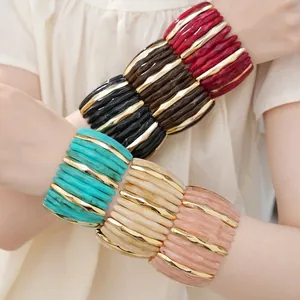 Bohemian style acrylic marbled elastic bracelet with gold wavy accents for women