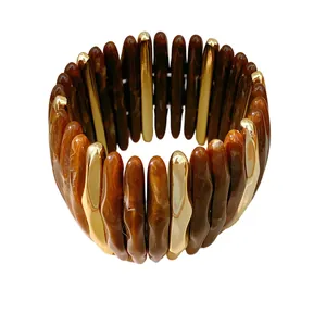 Luxury elastic acrylic bracelet featuring marbled brown and gold-tone wavy segments