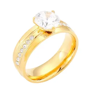 Bague élégante en acier inoxydable doré avec une pierre centrale en zircone à 4 griffes