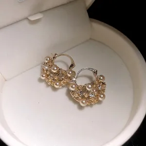 Elegant French retro hollow pearl flower basket hoop earrings in a luxury cream box