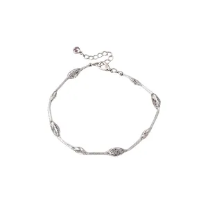 Elegant silver bracelet featuring textured oval beads and adjustable extender chain.