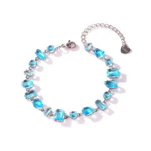 Detailed view of stainless steel bracelet featuring multi-shaped blue zircon stones.