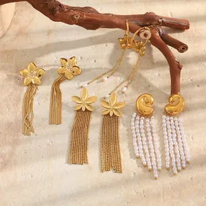 Bohemian style 18K gold plated earrings featuring delicate flowers and pearl tassels.