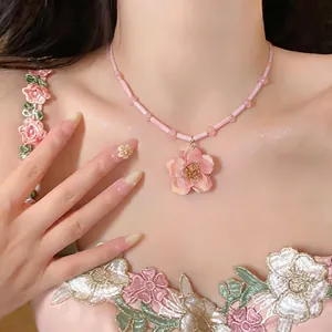 Elegant pink beaded necklace with a delicate 3D flower pendant for sweet fashion.