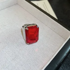 Elegant vintage silver ring featuring a large rectangular red synthetic gemstone