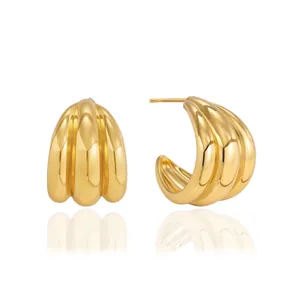 Elegant gold C-shaped hoop earrings with a textured triple-ribbed design in stainless steel