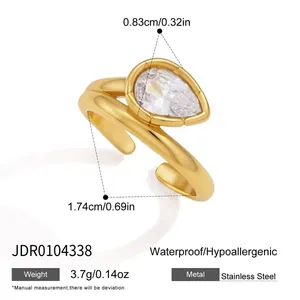 Detailed view of gold stainless steel ring with pear-shaped zircon and measurements