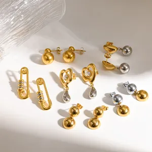 Variety of two-tone 18k gold and silver stainless steel earrings in modern designs