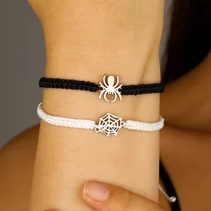 Close-up detail of Halloween spider and web braided adjustable bracelets on wrist