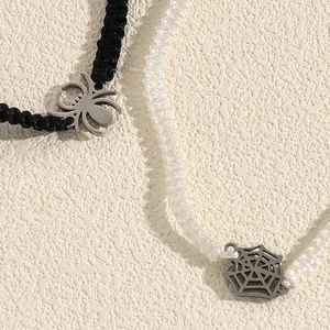 Close-up of woven Halloween spider and spiderweb bracelets in black and white