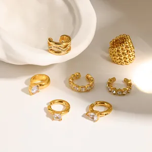 Detailed shot of various elegant gold zircon ear cuffs for non-pierced ears in a set