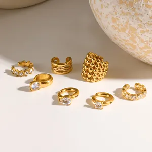 Detailed view of seven gold-toned ear cuffs featuring diverse cubic zirconia designs