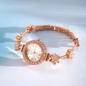Detailed view of an elegant rose gold women's watch with floral rhinestone bracelet band.