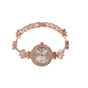 Elegant rose gold rhinestone flower bracelet watch with minimalist white background