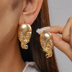 Gold matte human mask face stud earrings featuring a unique abstract artistic design (82)