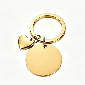 Detailed view of polished gold stainless steel heart keychain with blank round disc