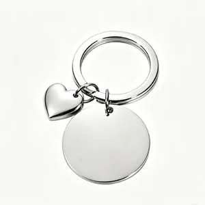 Close-up detail of mirror polished stainless steel heart and circle tag keychain accessory
