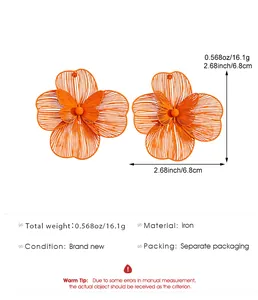 Oversized orange hollow flower earrings with butterfly detail, 6.8cm size and weight specs.