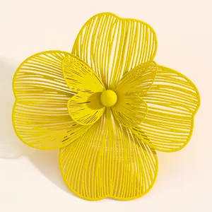 Macro shot of a vibrant yellow large double-layer hollowed-out floral statement ring