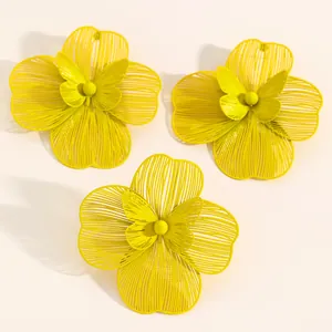 Detailed view of yellow hollow double-layer flower jewelry set with earrings and open ring