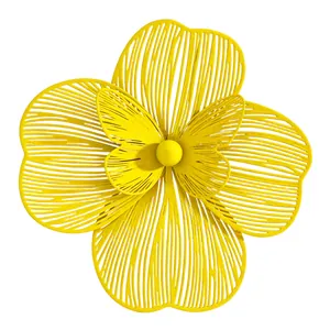 Detailed view of large yellow double-layer hollowed-out flower earring accessory