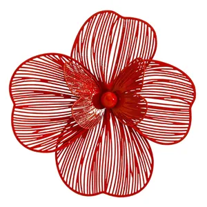 Detailed macro view of an oversized and artistic hollow red flower jewelry design